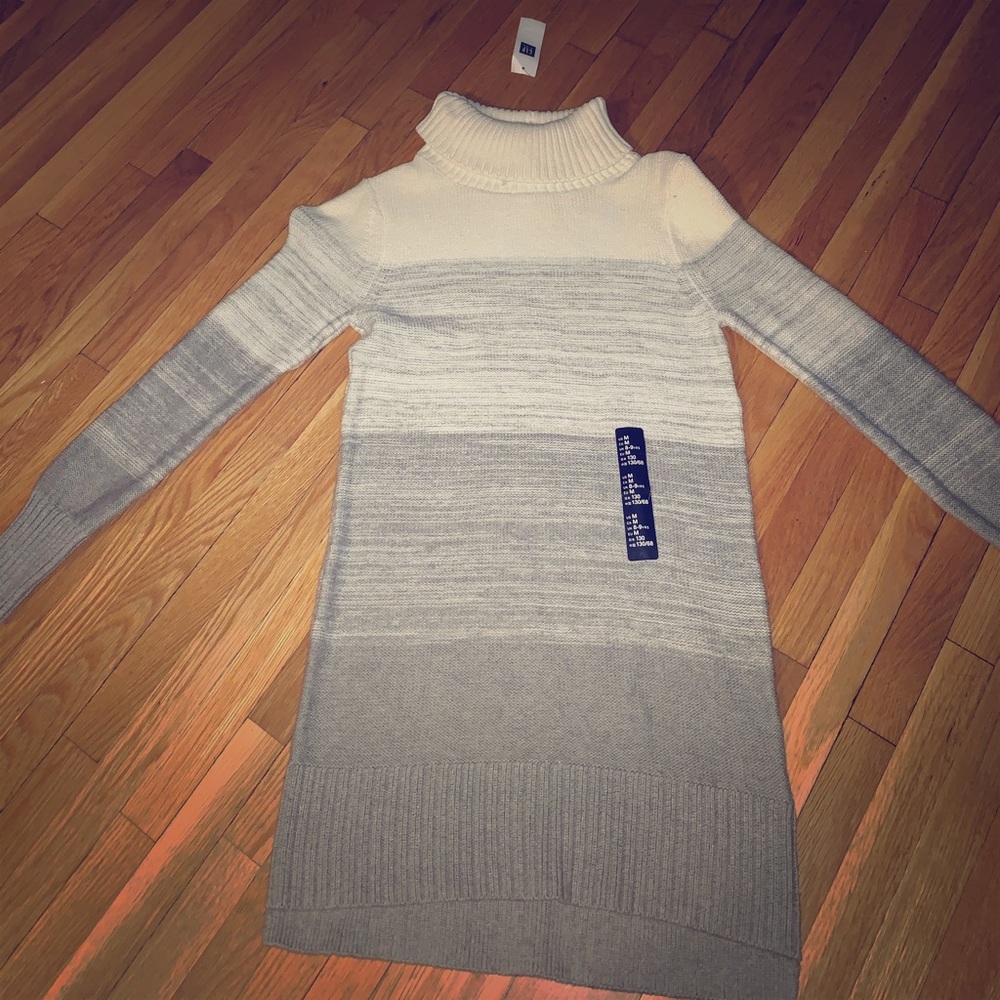 Its a dress and it has a small turtle neck.